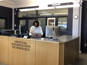 a photo of students at OIT desk
