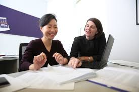 a photo of 2 students in a conversation